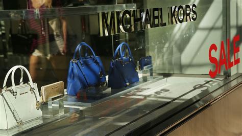 michael kors buys owner.